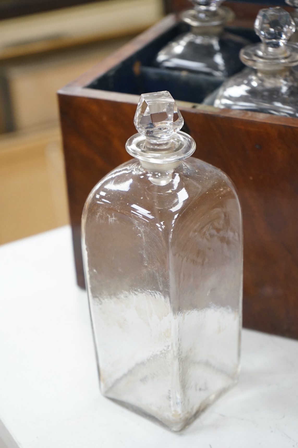 A George III mahogany four bottle decanter box, 26cm